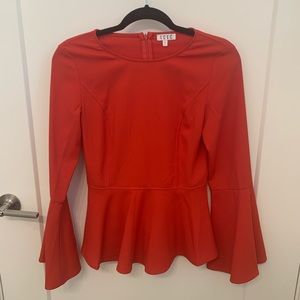 Women’s shirt with bell sleeves.